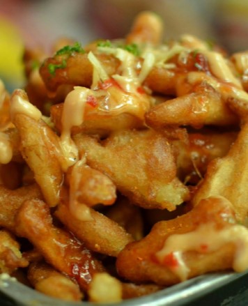 Loaded Fries from Burgerzzz in Airdrie, Battered fries with cheese and chilli sauce.